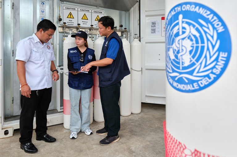man checking the oxygen tanks