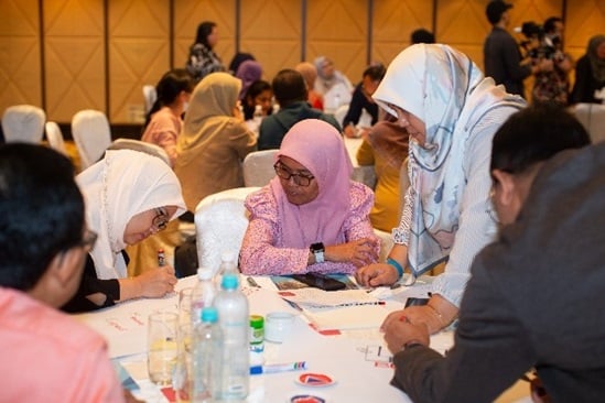 Participants engaging sessions during a behavioural insights training.